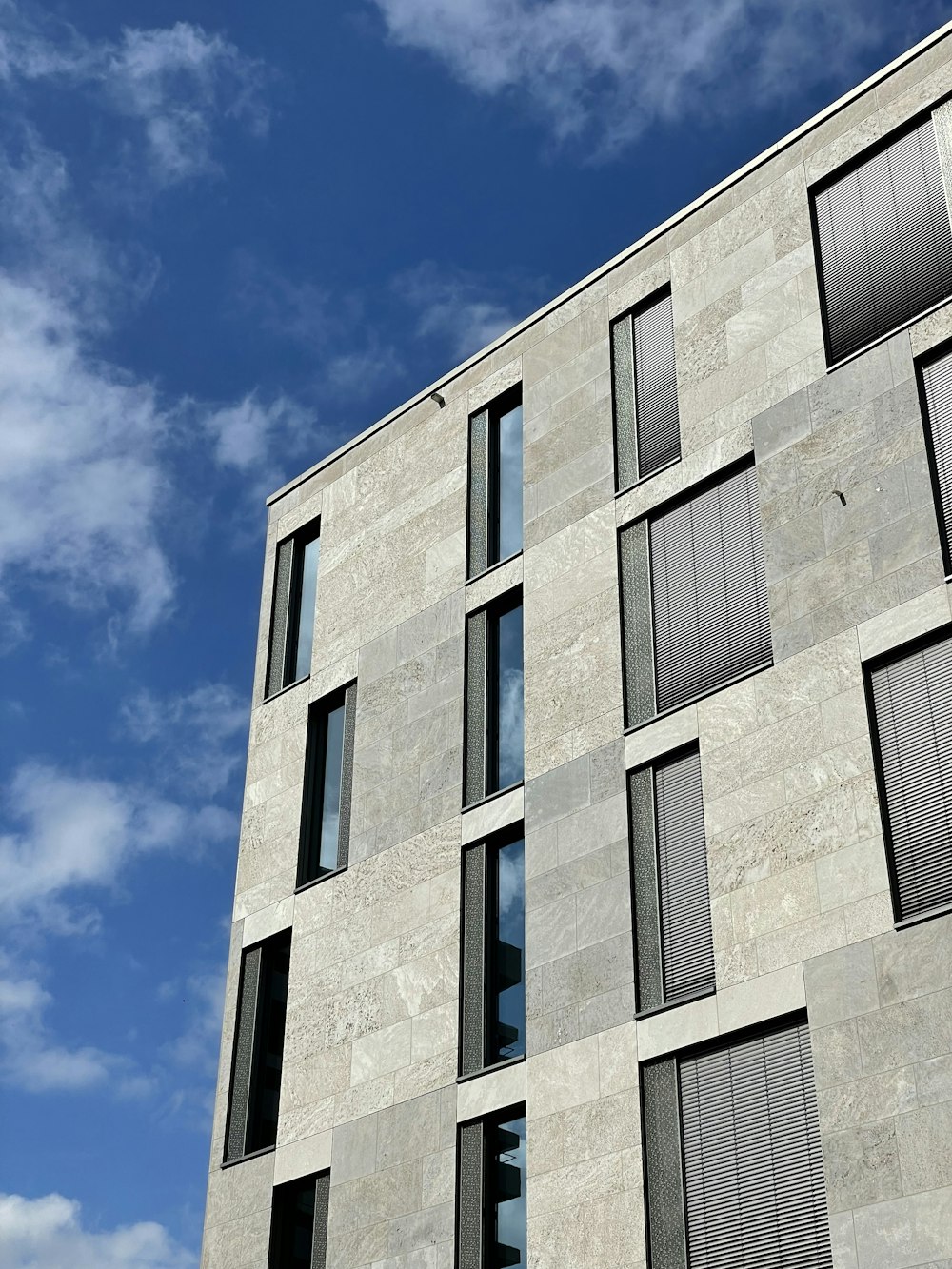 a tall building with lots of windows and a clock