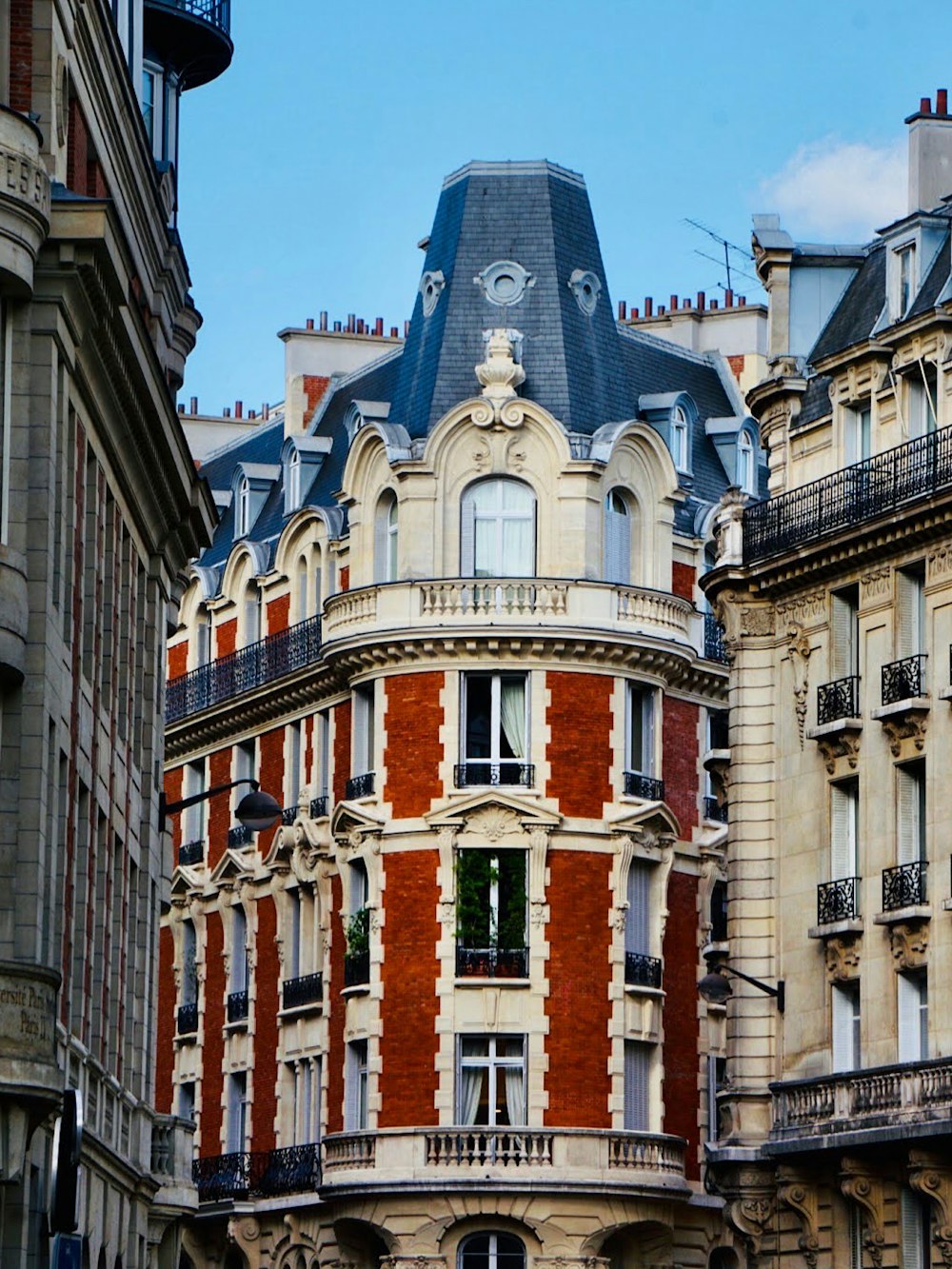 a tall building with a clock on the top of it