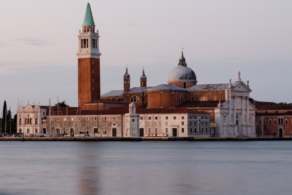 a large body of water with a large building in the background