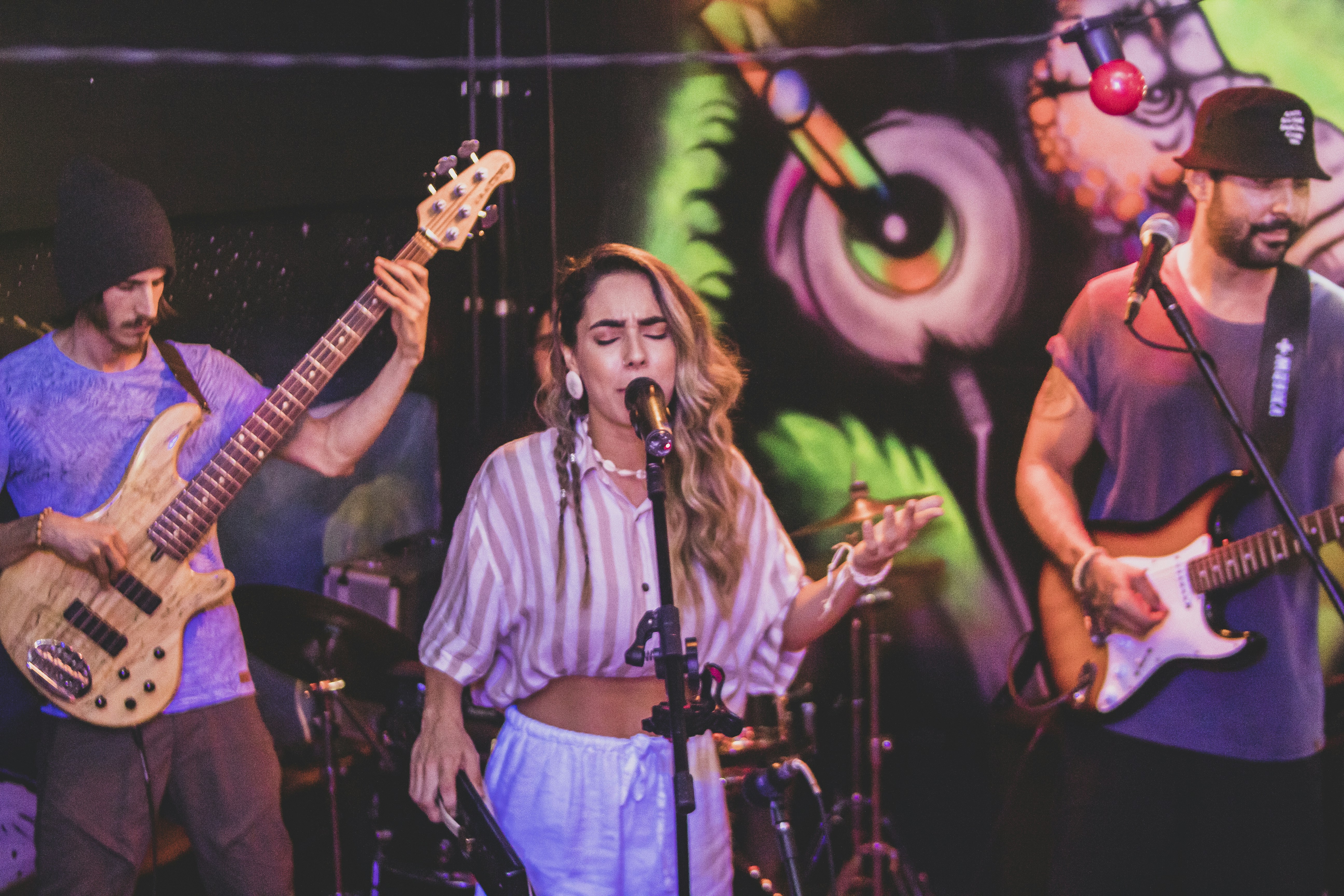 a group of people that are playing guitars