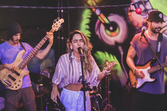 a group of people that are playing guitars