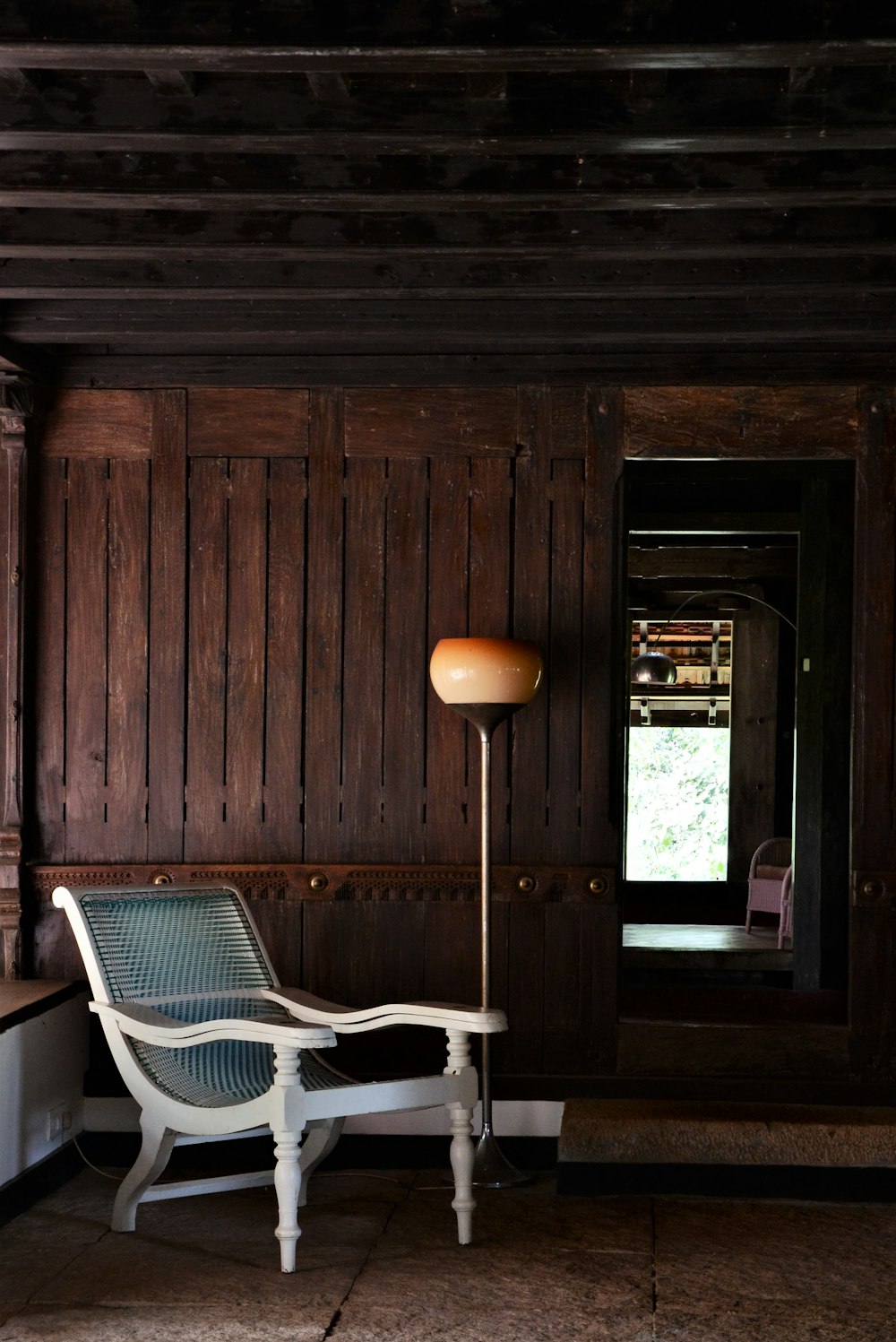 a chair and a lamp in a room