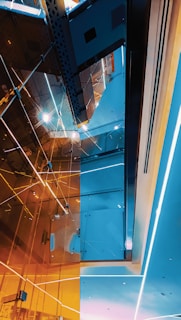 High-end modern architecture bathed in subtle metallic platinum lighting, reflecting luxury.