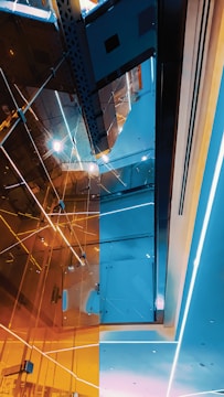 A sleek indoor architectural space highlighted by subtle, glowing LED accents.