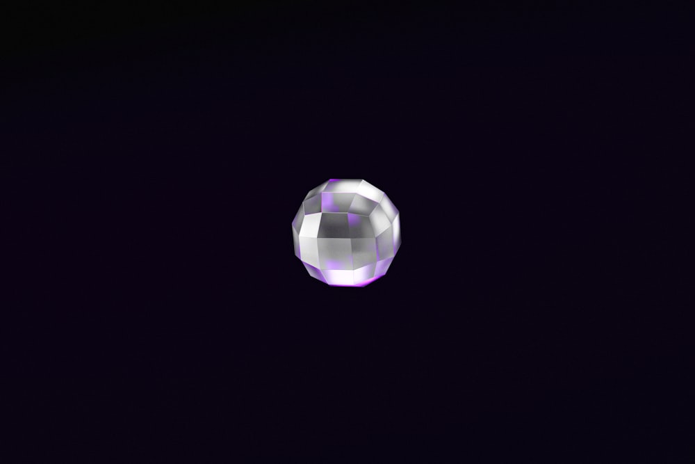 a purple and white object in the dark