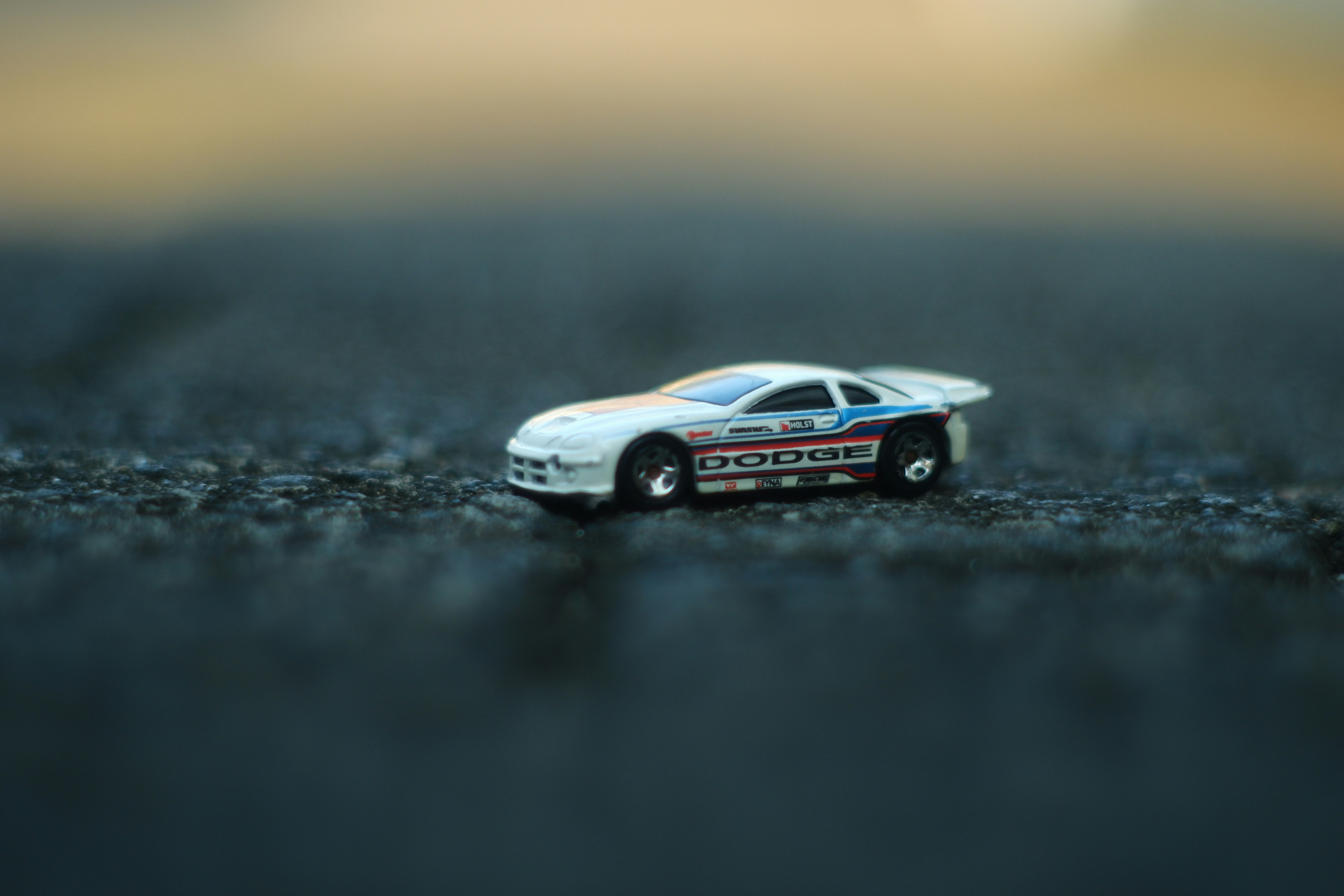 a toy car sitting on top of a black surface