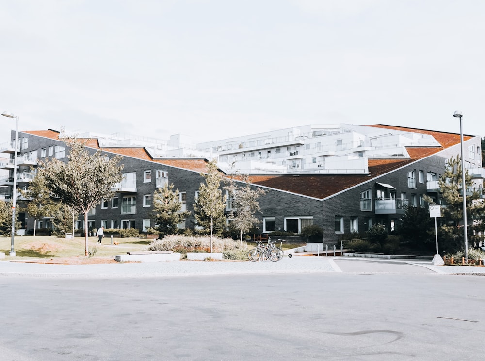 a group of buildings sitting on the side of a road