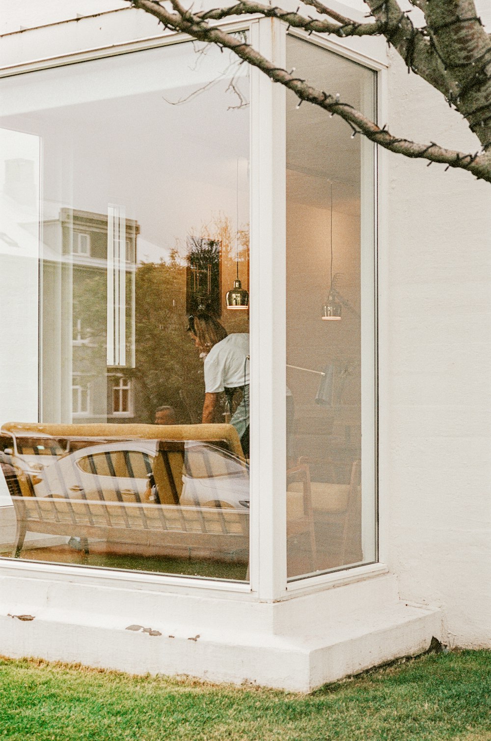 a wooden bench sitting in front of a window