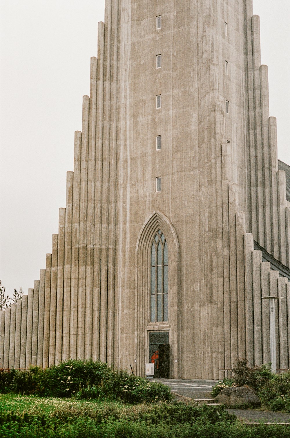 a tall building with a clock on the front of it