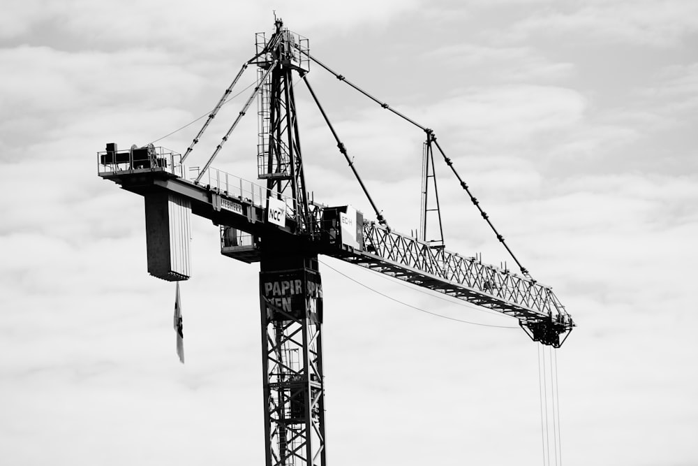 a black and white photo of a crane