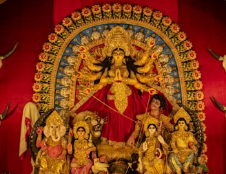 a statue of a woman surrounded by other statues