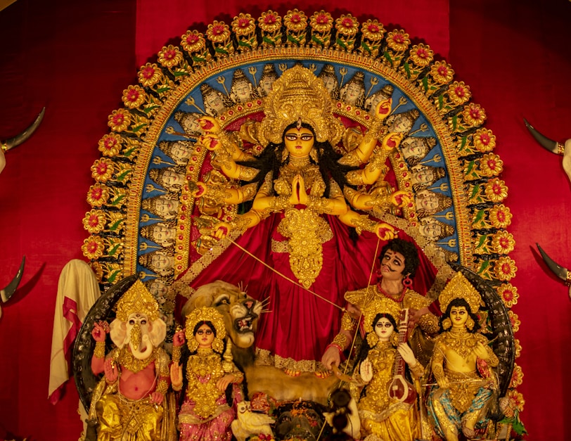 a statue of a woman surrounded by other statues