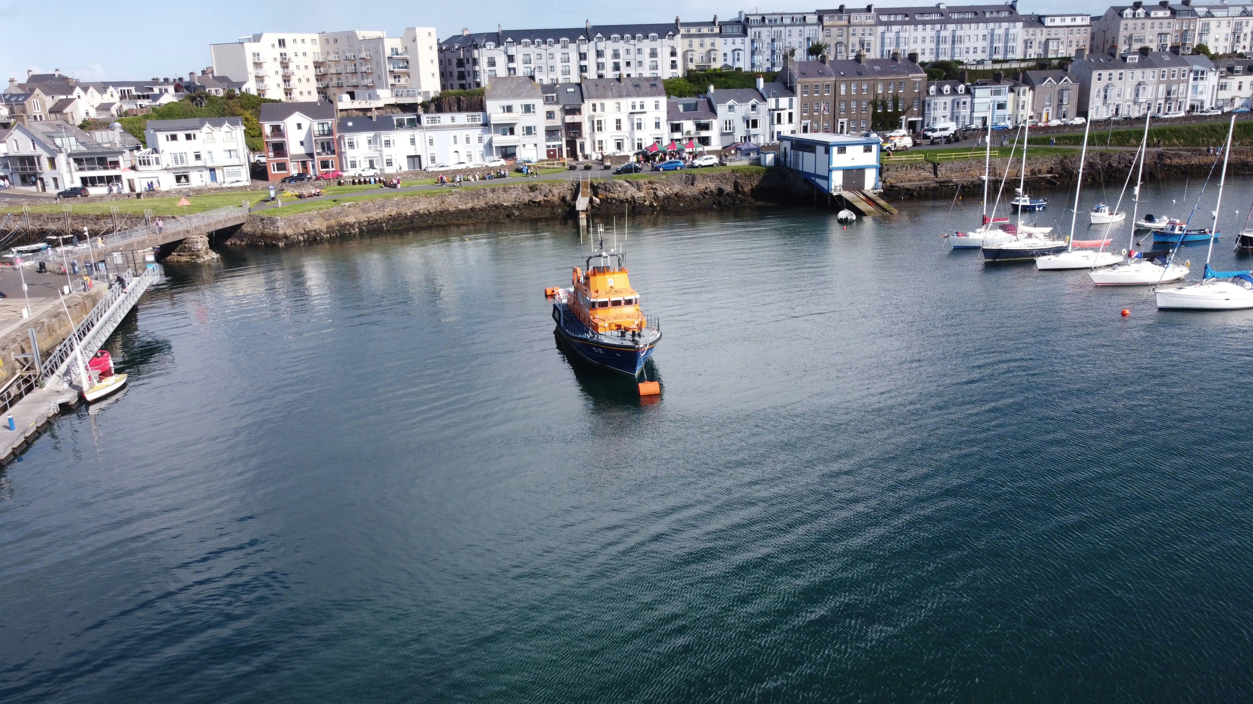 a group of boats floating on top of a body of water