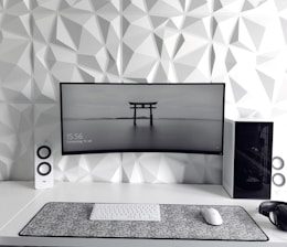 a computer monitor sitting on top of a desk