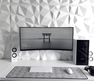 a computer monitor sitting on top of a desk