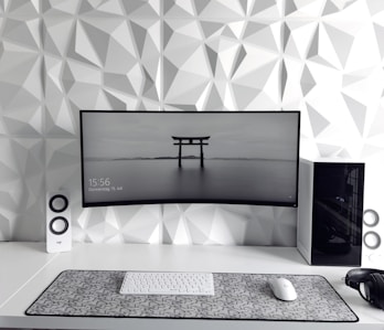 a computer monitor sitting on top of a desk