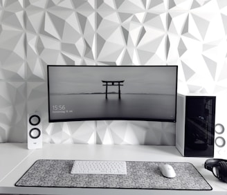 a computer monitor sitting on top of a desk
