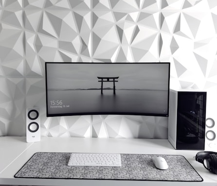 a computer monitor sitting on top of a desk