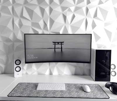 a computer monitor sitting on top of a desk