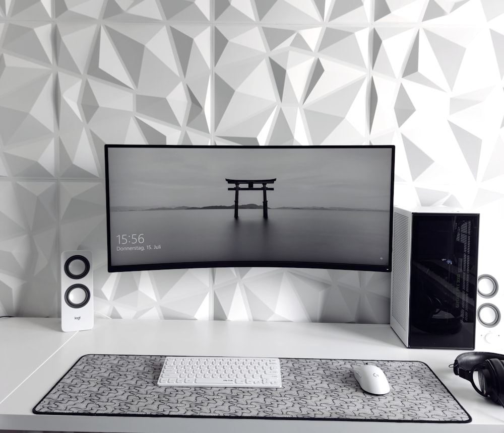 a computer monitor sitting on top of a desk