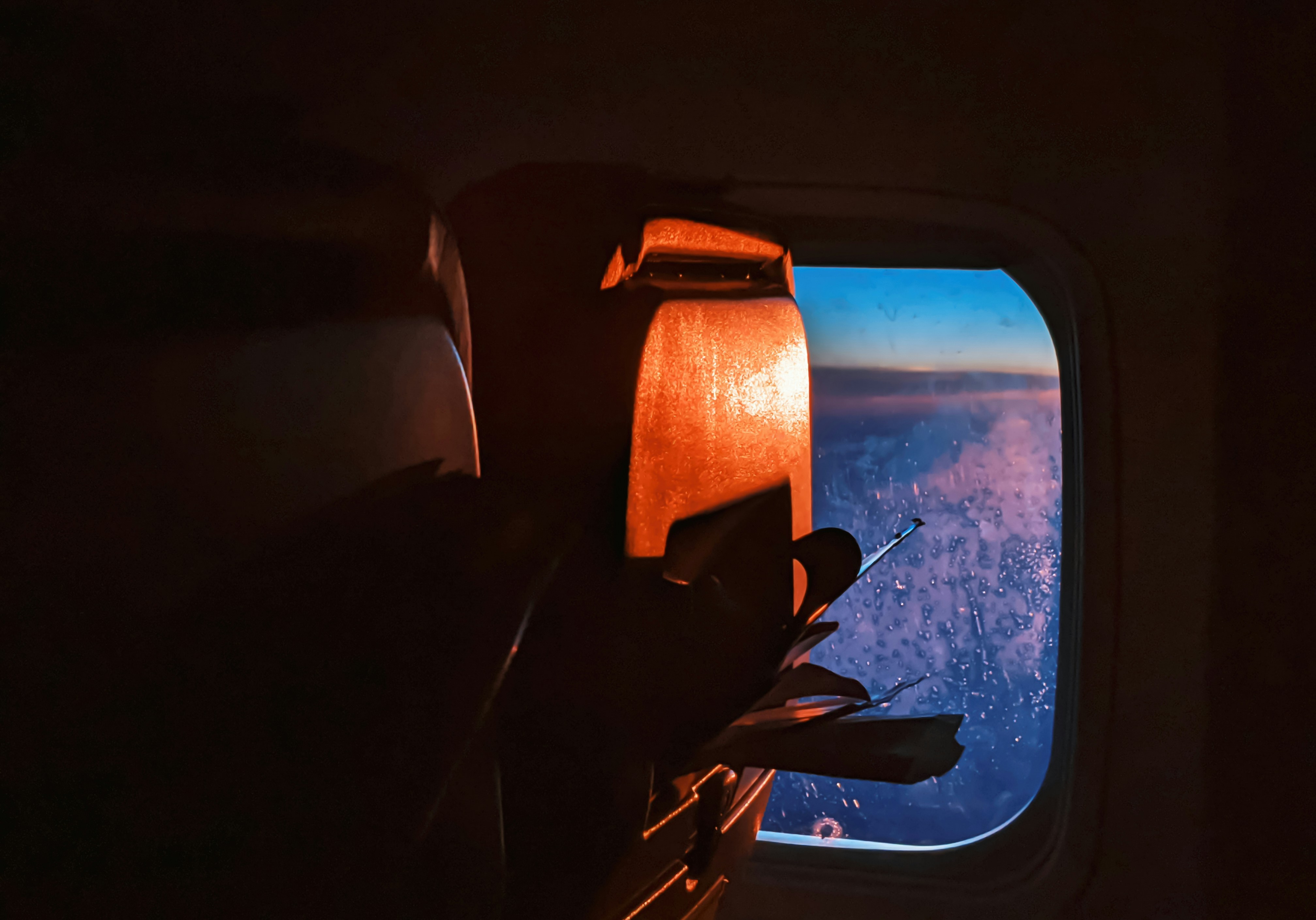 a view of the wing of an airplane through a window