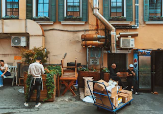 a group of people sitting outside of a building