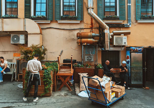 a group of people sitting outside of a building