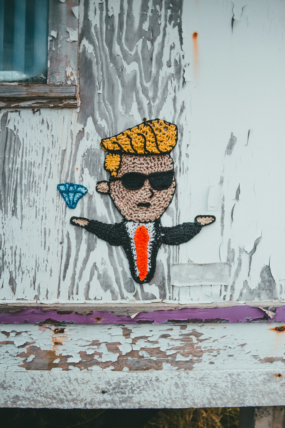 a sticker of a man with a hat and sunglasses