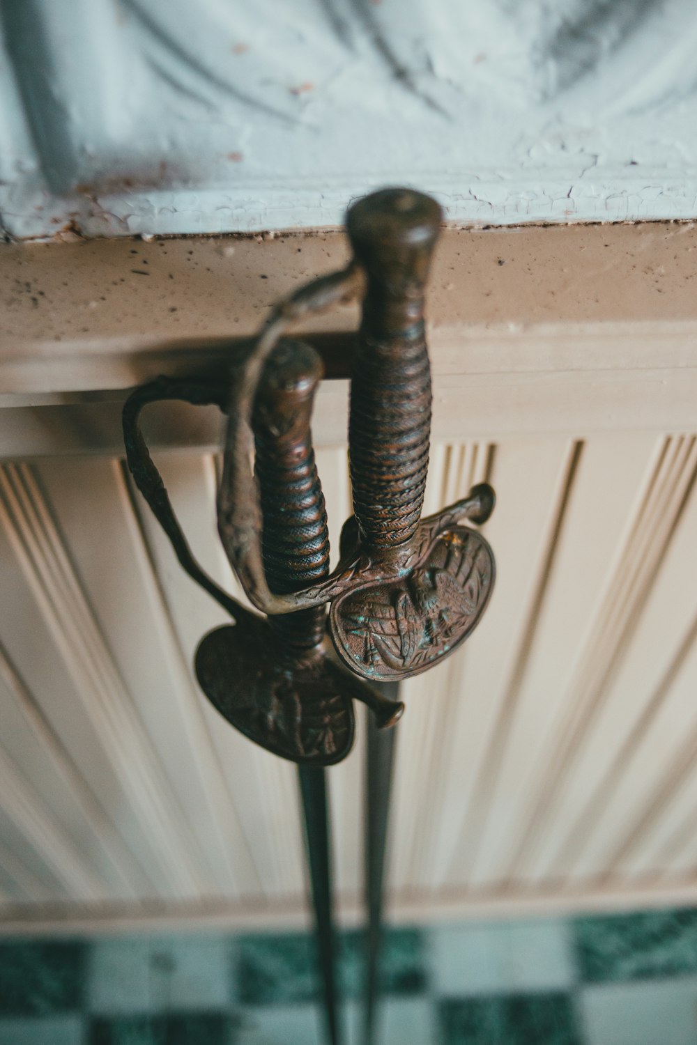 a close up of a metal object on a ceiling