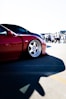 a red sports car parked in a parking lot