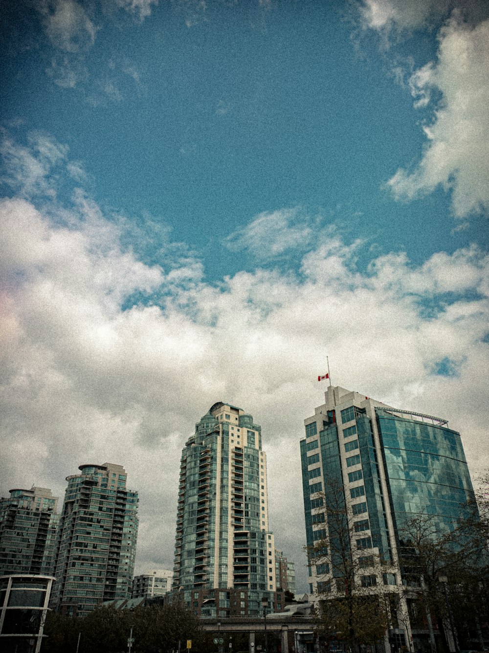 a group of tall buildings sitting next to each other