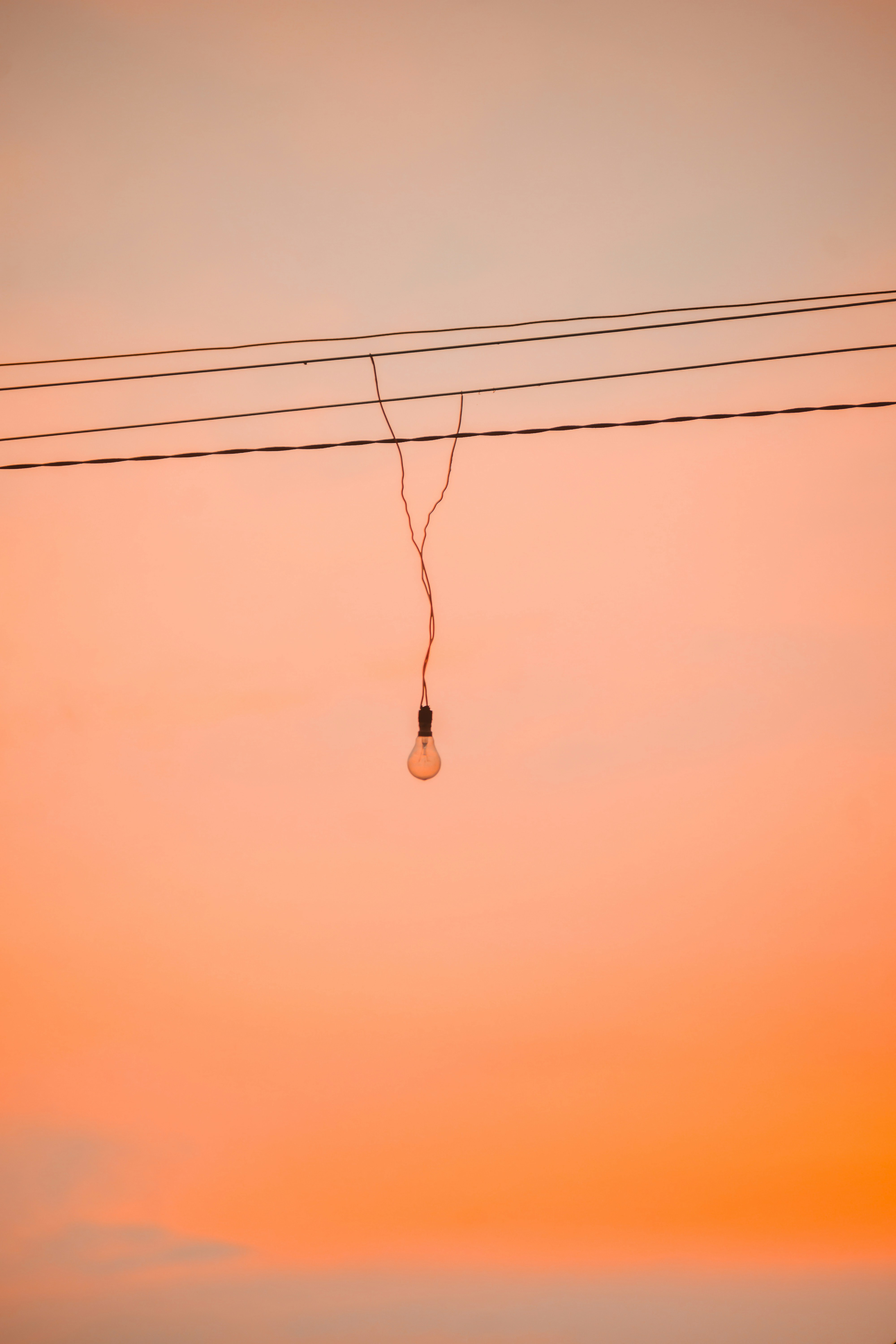 woman wearing yellow long-sleeved dress under white clouds and blue sky during daytime