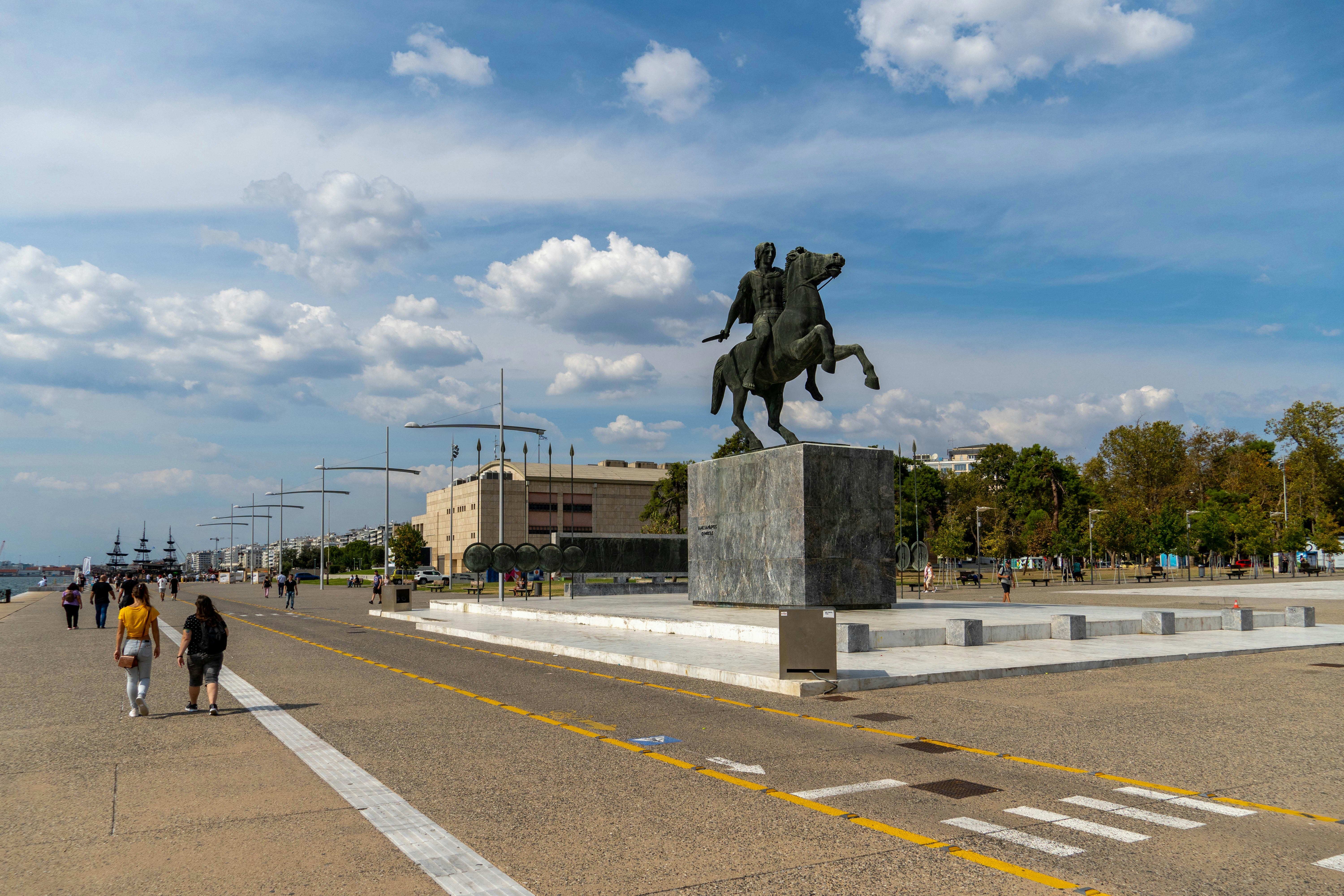 a statue of a man on a horse in a parking lot