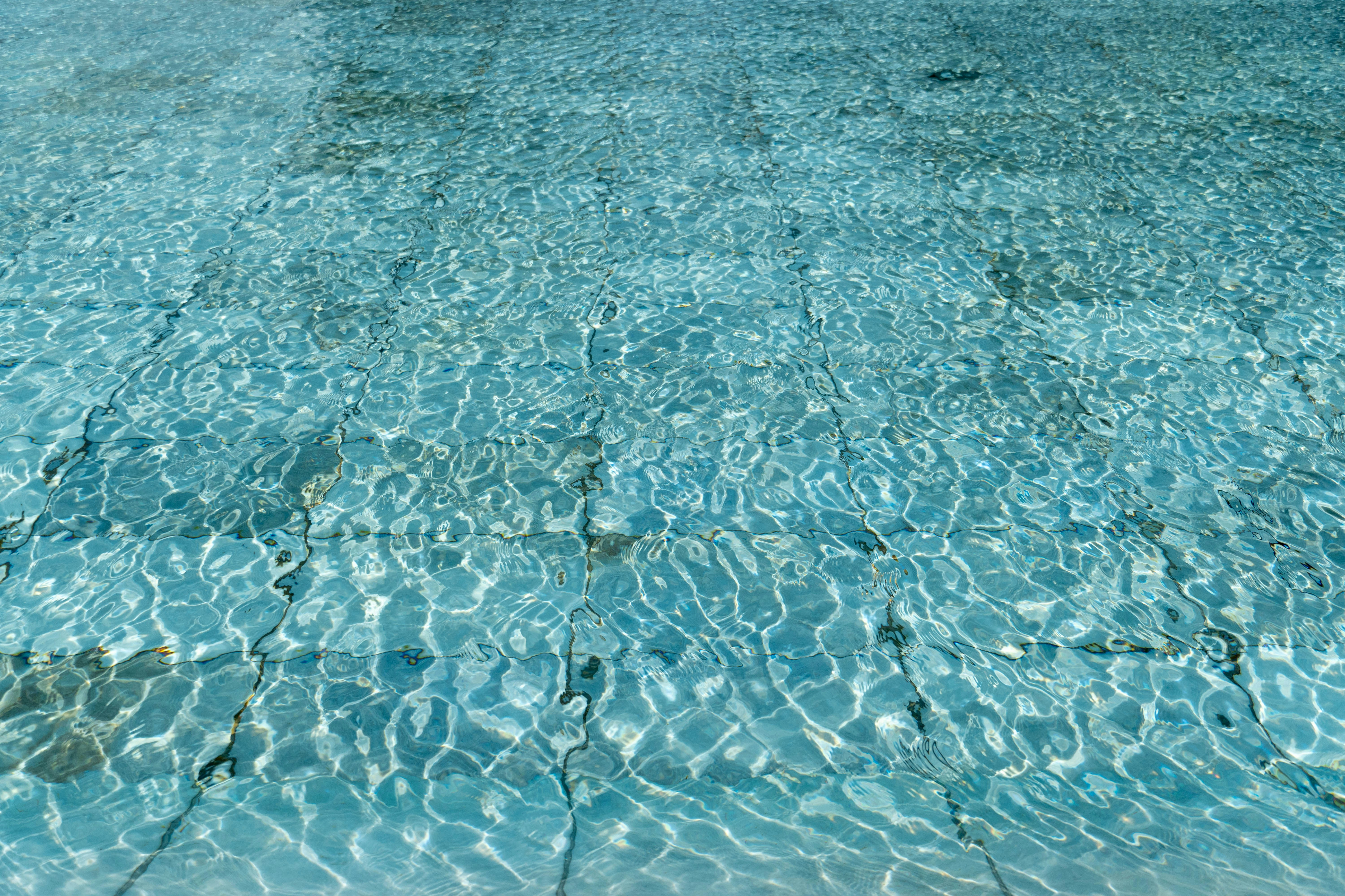 a swimming pool with clear blue water