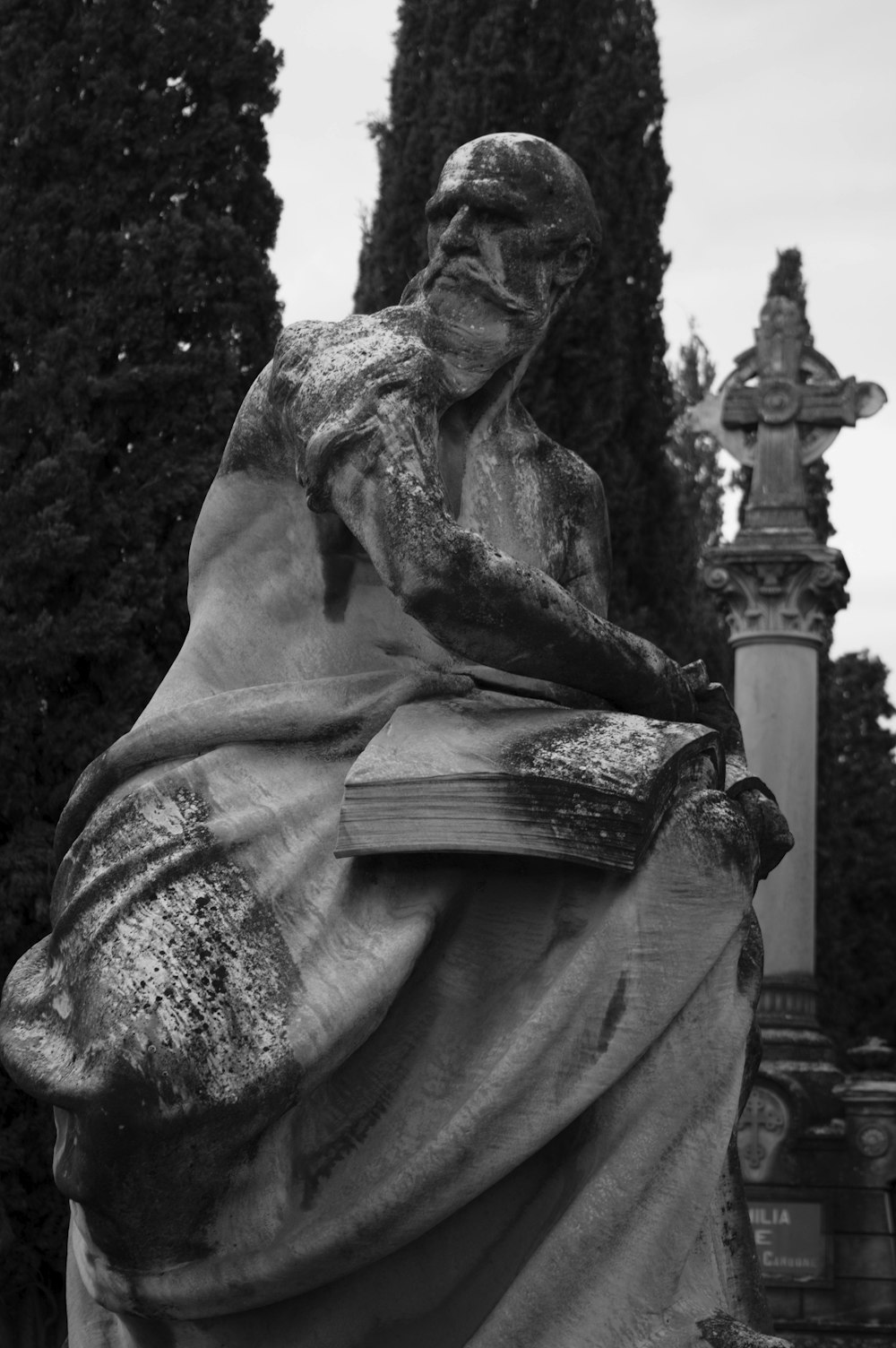 a black and white photo of a statue