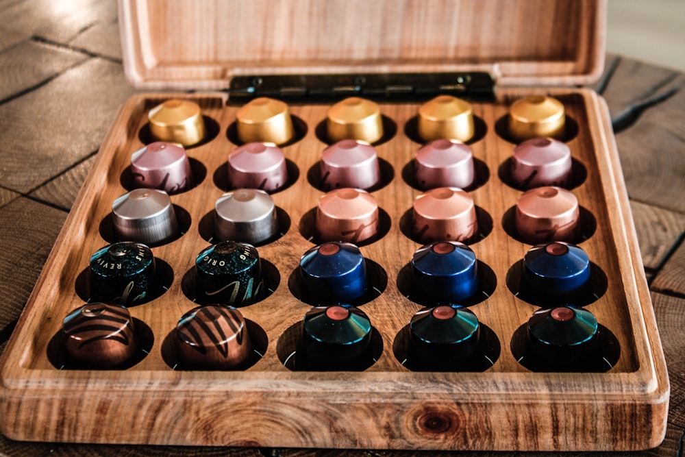 a wooden box filled with lots of chocolates