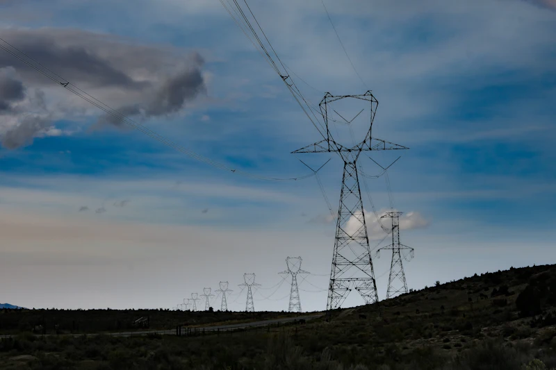 High-voltage power line crossing a field