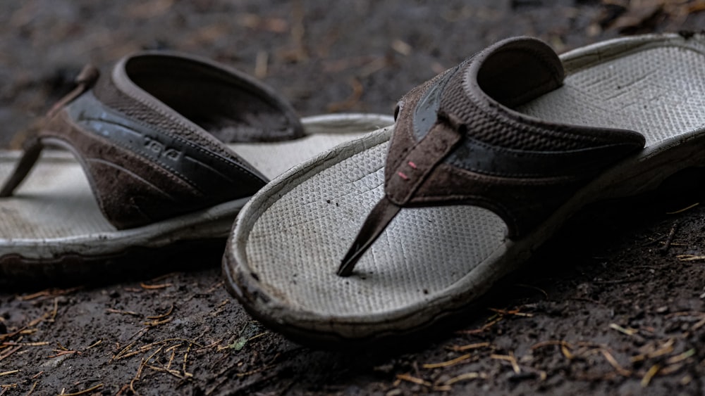 a pair of dirty shoes laying on the ground