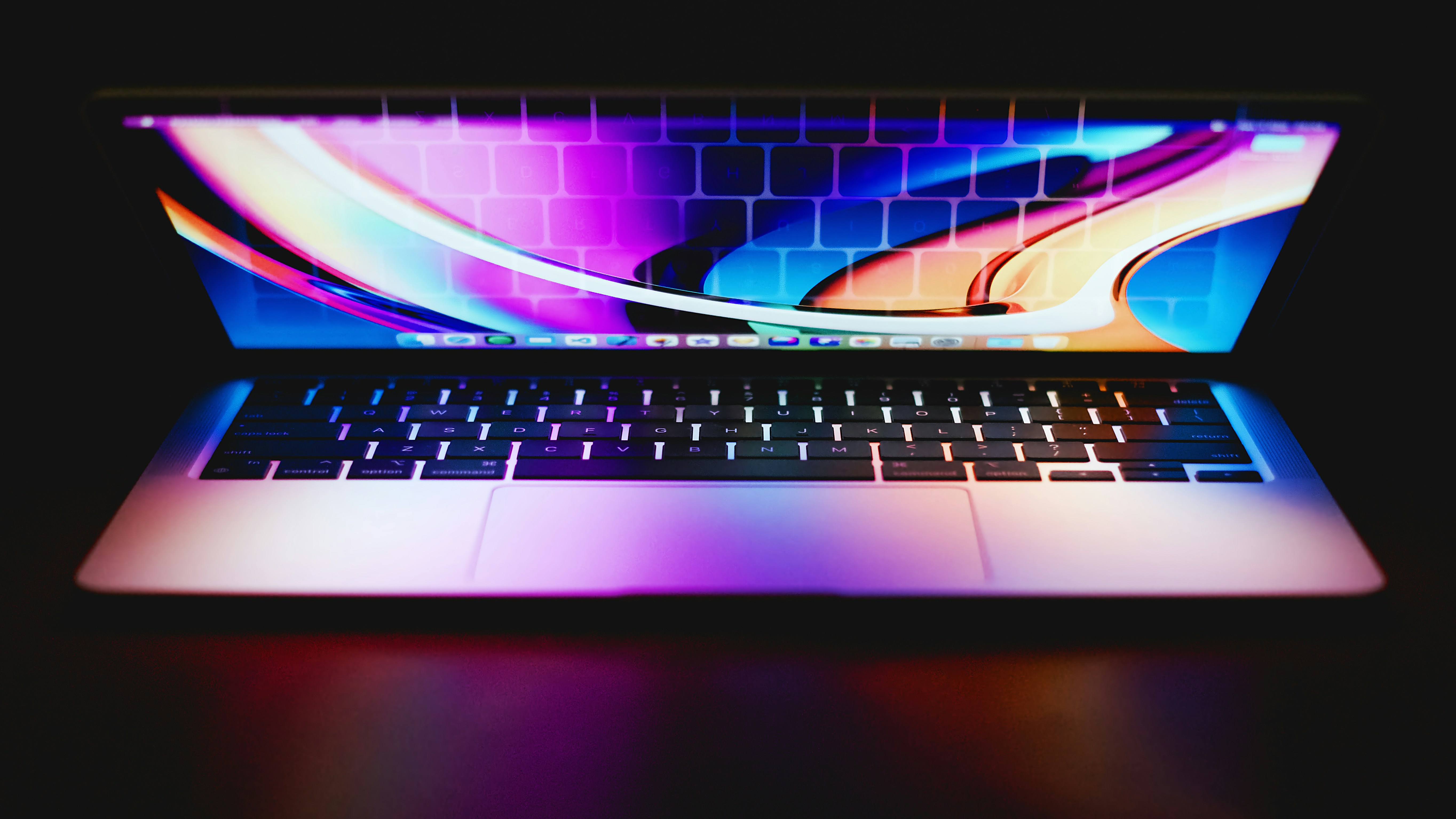 a laptop computer sitting on top of a table