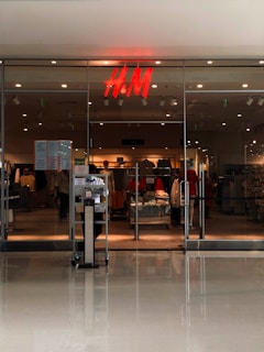 Stylish H&M clothing pieces hanging neatly in a bright, airy boutique setting