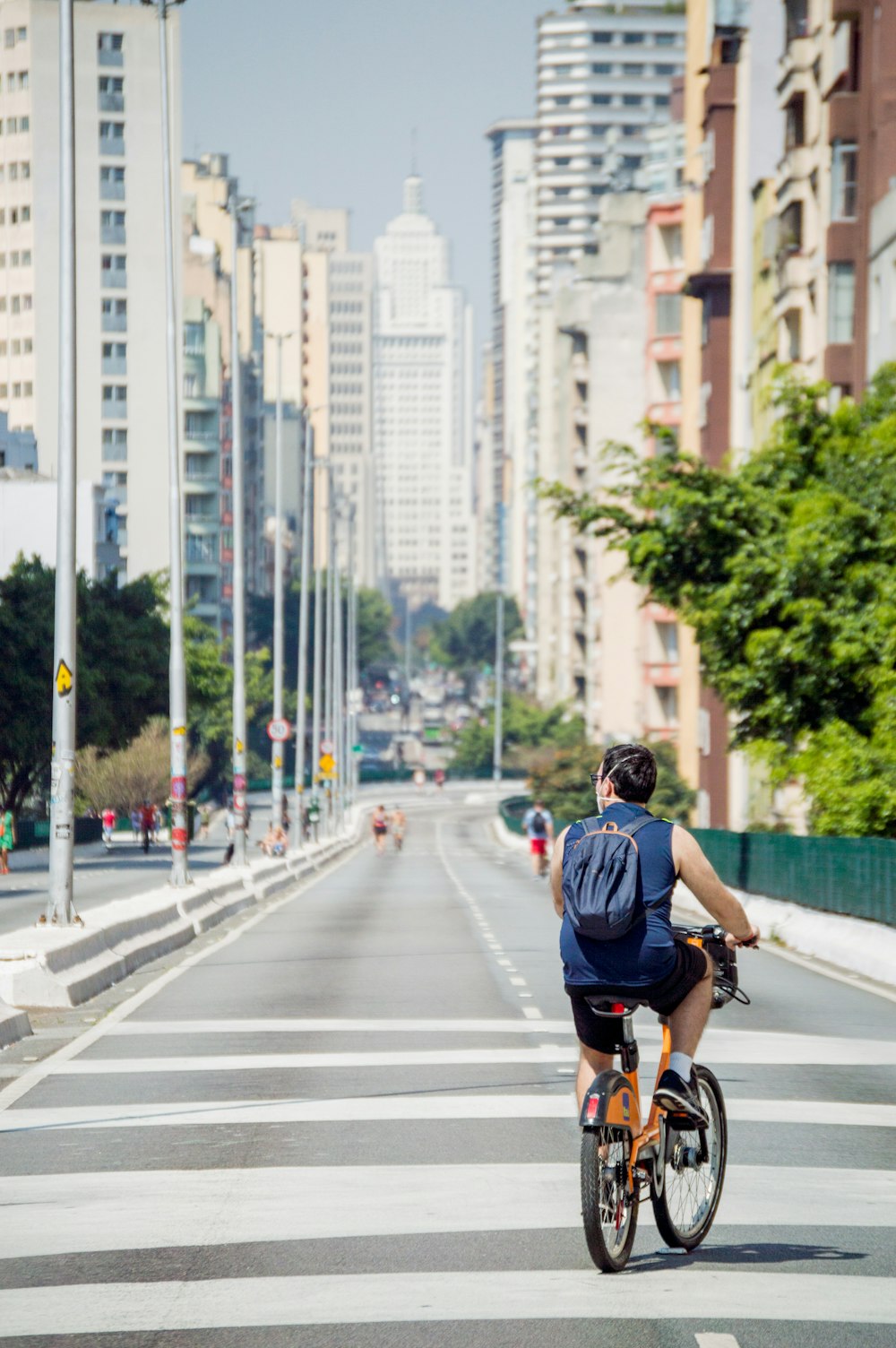 a person riding a bike across a street