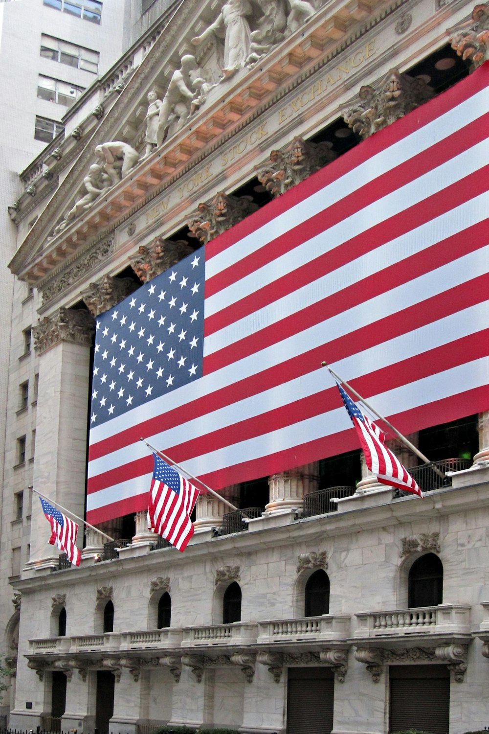 a building with a large american flag on the side of it