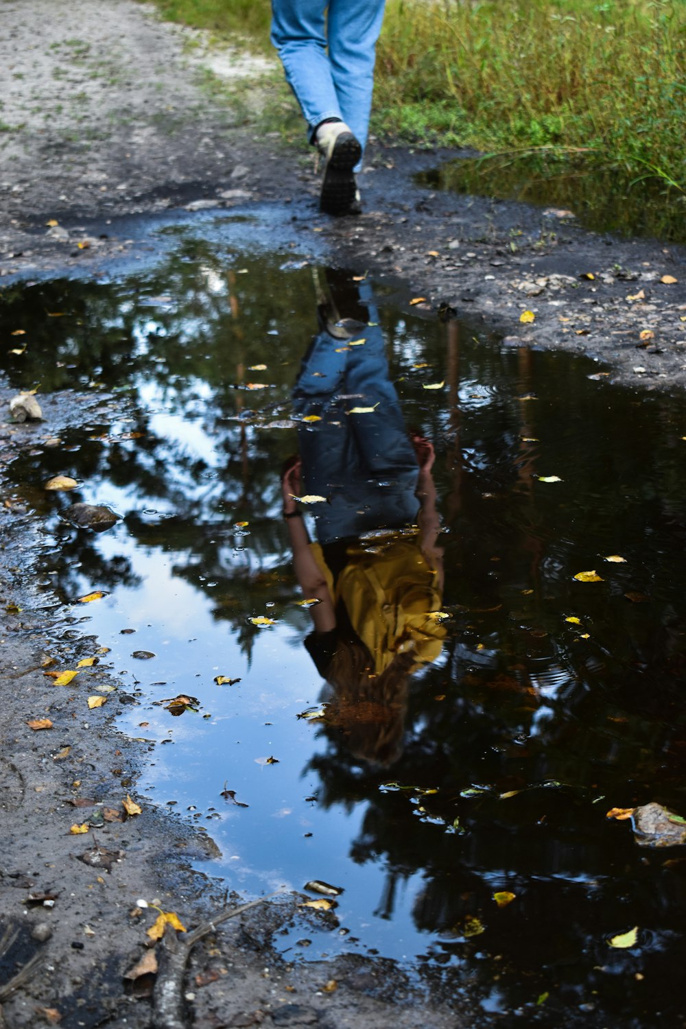 a person walking in a puddle of water