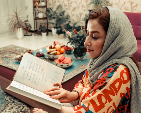 A warm, inviting workspace with books and notes reflecting Middle Eastern studies and women's history.