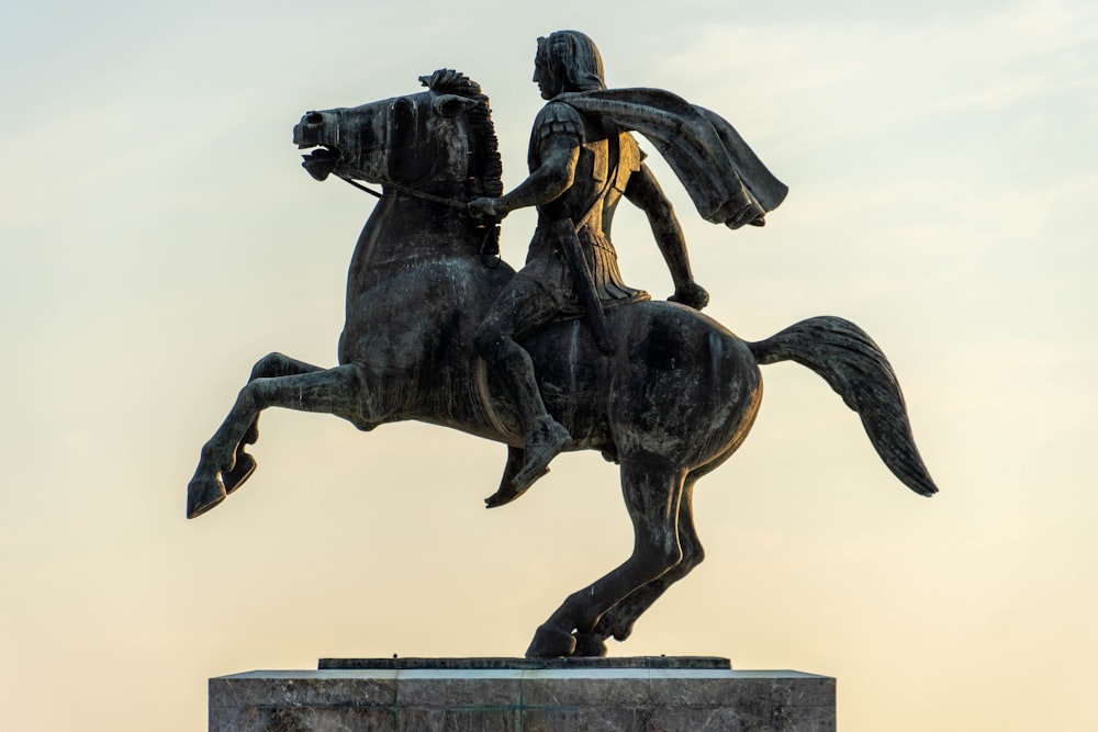 a statue of a man riding a horse