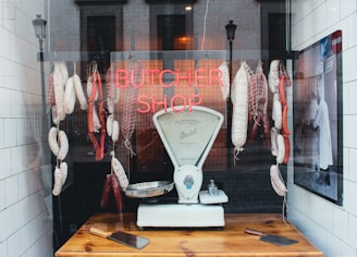 a butcher shop with meat hanging from the ceiling