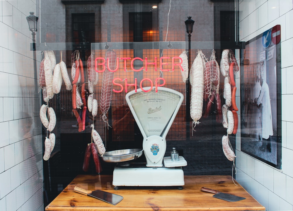 a butcher shop with meat hanging from the ceiling