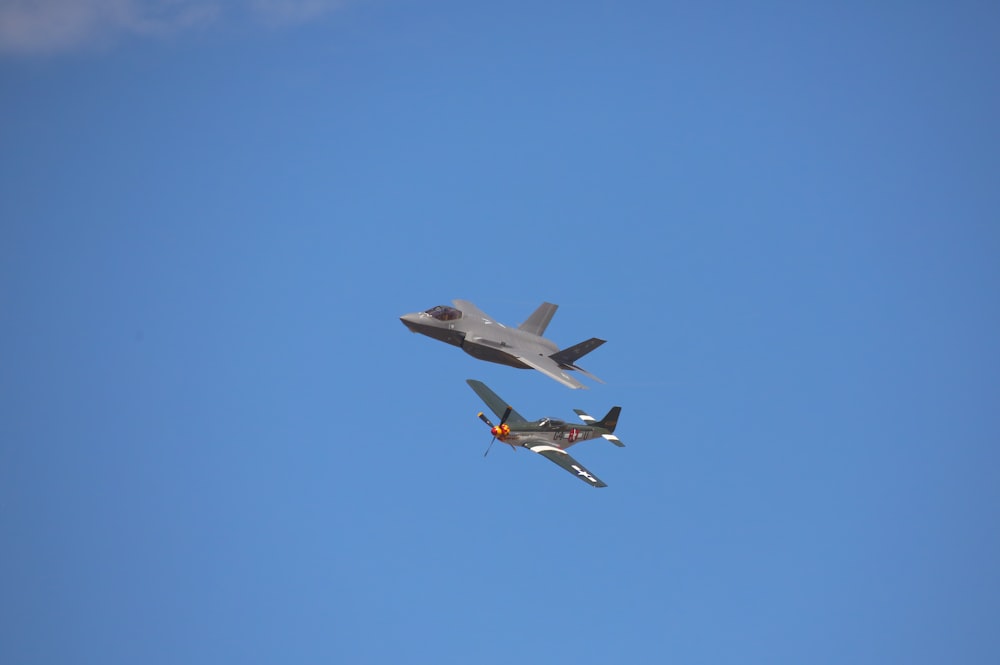 a fighter jet flying next to a fighter jet