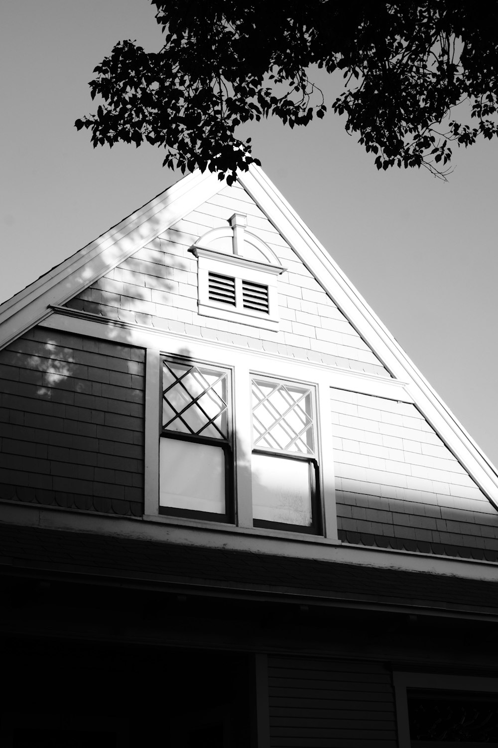 a black and white photo of a house