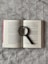 a book with a magnifying glass on top of it